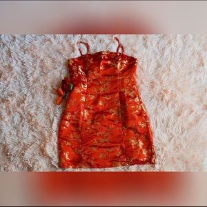 Silk red dress with gold embroidery.